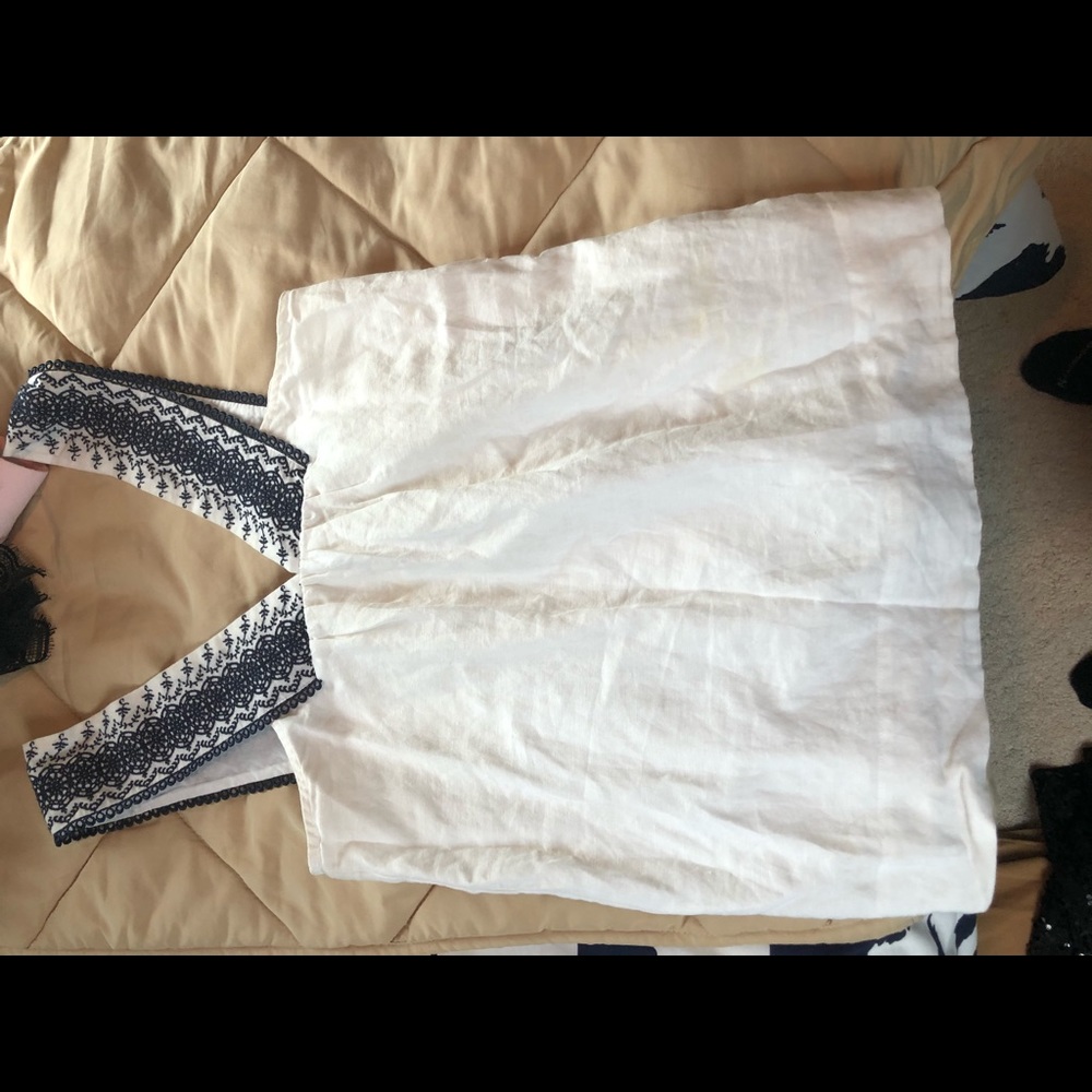 White tank top with design on straps